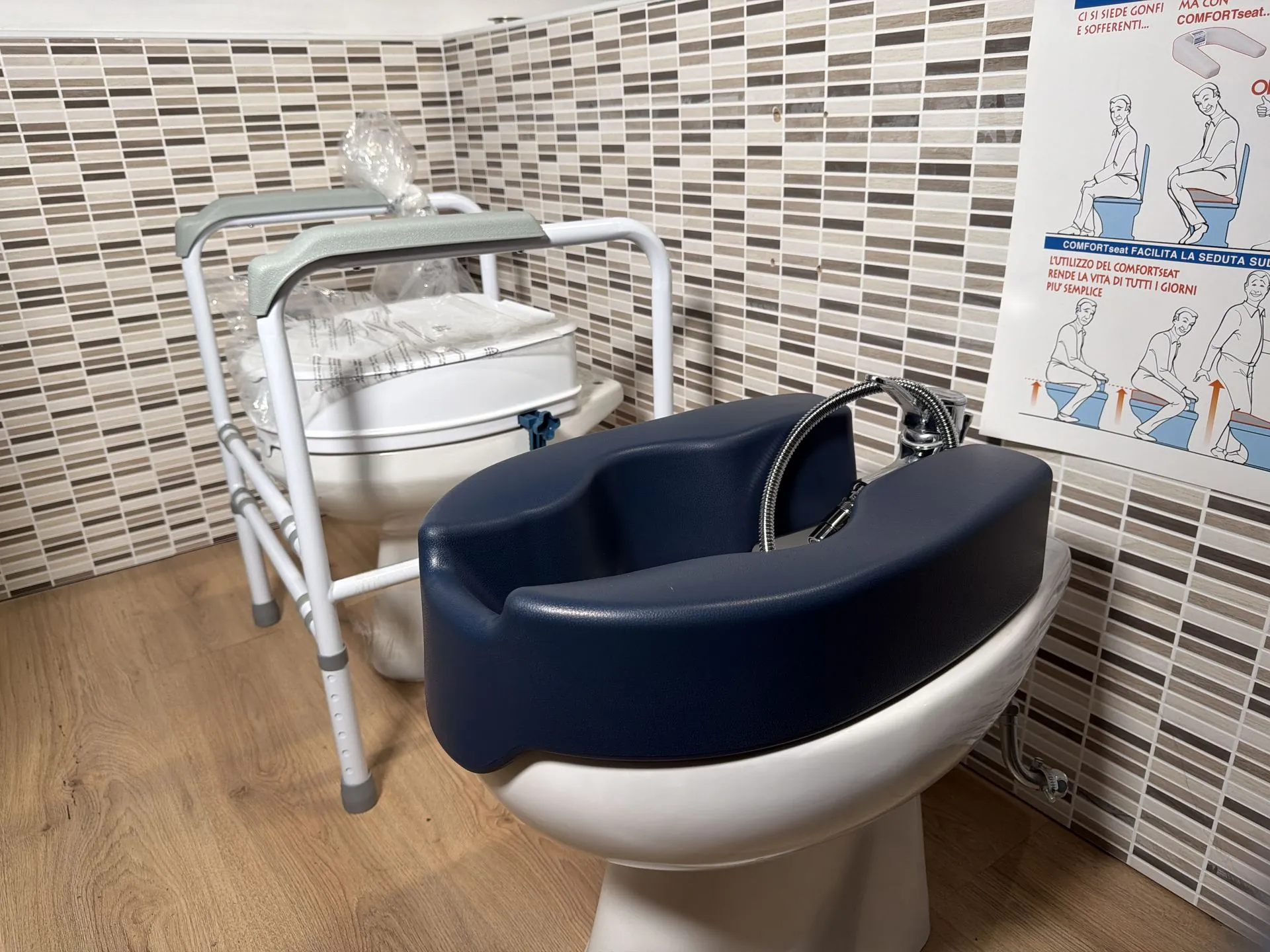 A soft raised toilet seat and a toilet support frame in the Cocoon showroom