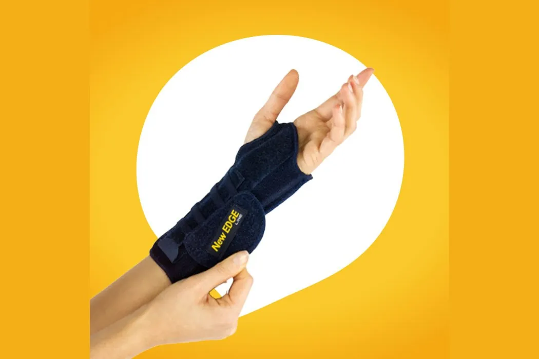A wrist and thumb brace worn on a hand