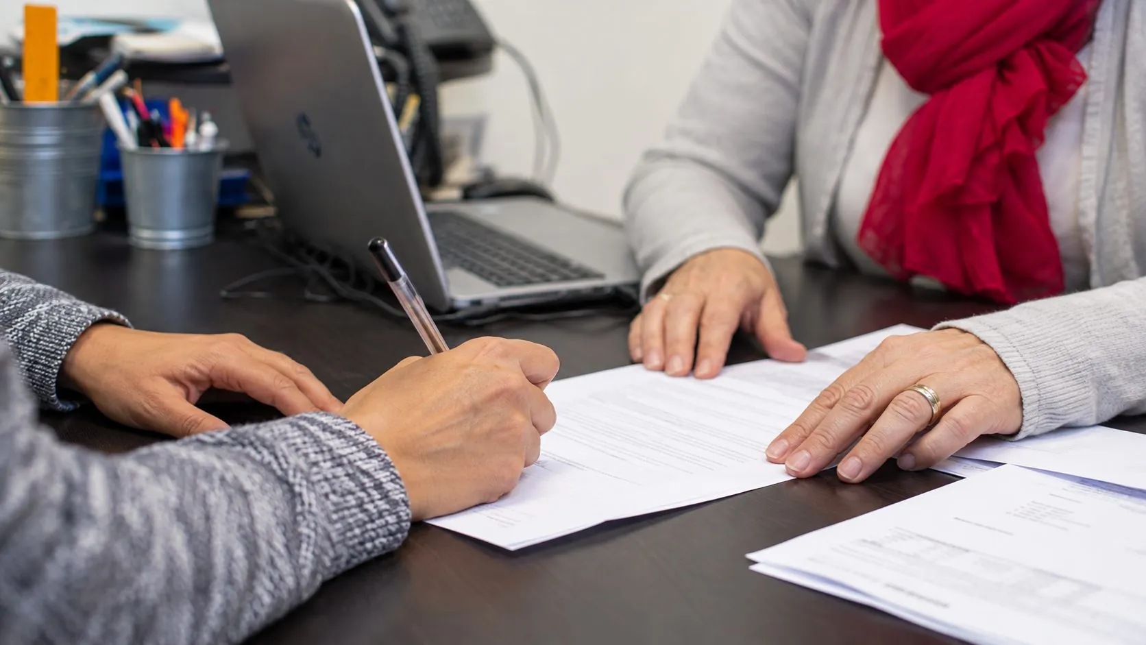 Signing the employment contract at the coordinator’s desk
